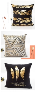 Detail of gold foil pillow covers with leaf patterns and Follow Your Dreams slogan