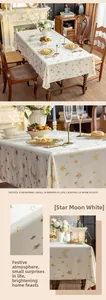 Macro detail of creamy white velvet tablecloth with golden star and moon foil printing