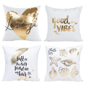 Set of four white decorative pillow covers with gold foil heart and shell patterns