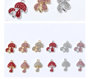 Detailed view of colorful rhinestone mushroom charms with gold and silver brass plating
