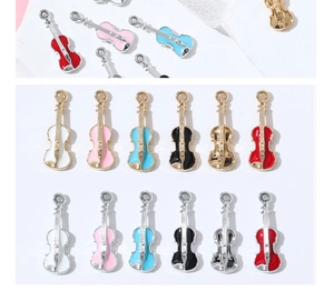Detail of colorful violin pendants made of oil-dripping alloy for DIY jewelry crafting