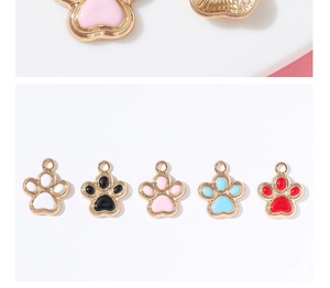 Close-up of DIY glitter paw pendants in five colors for jewelry making accessories