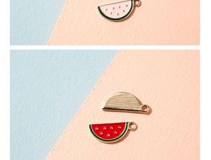 Macro shot of watermelon enamel pendants with gold alloy edges for DIY jewelry making