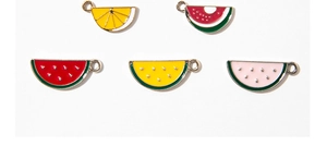 Detailed view of alloy enamel fruit charms including watermelon and lemon for DIY jewelry