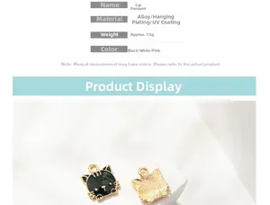 Detailed view of cartoon cat alloy charm with gold plating and black enamel finish