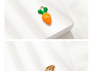 Macro detail of carrot alloy pendant showing enamel front and textured metal back