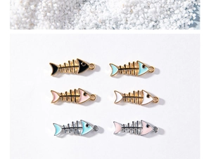 Macro view of assorted colorful fishbone alloy pendants in gold and silver finishes