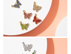 Detailed close-up of colorful butterfly charms with crystal stones for DIY jewelry making