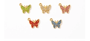 Detailed view of alloy butterfly charms with colorful rhinestones in five vibrant colors