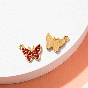 Sparkling butterfly pendants with deep red rhinestones and gold alloy base for DIY jewelry