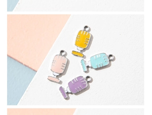 Detailed view of colorful microphone enamel charms for DIY jewelry making accessories