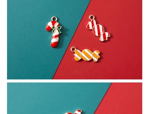 Detailed view of alloy Christmas candy cane pendants with green bows and gold rings
