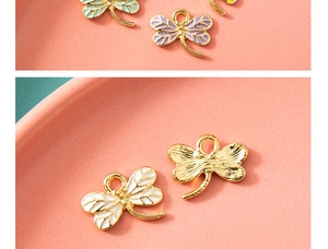 Detailed macro view of colorful enamel dragonfly pendants for DIY jewelry making crafts