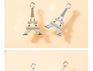 Details der Eiffelturm-Anhänger in Gold und Silber mit funkelnden Strasssteinen
