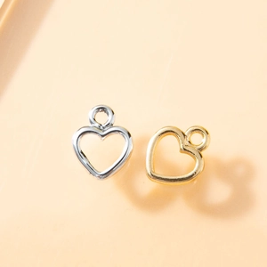 Pendenti a cuore in oro e argento con cornice a freccia per creazione di gioielli