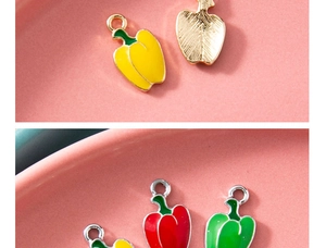 Detailed macro view of colorful enamel pepper charms showing front gloss and back texture