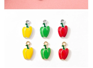 Detailed macro view of colorful bell pepper alloy charms in red yellow and green