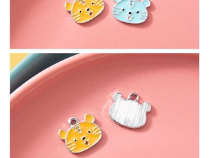 Detail of cartoon tiger alloy charms with colorful oil drip finish and brushed metal back