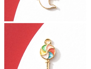 Macro detail of alloy enamel moon and colorful lollipop charms for DIY jewelry making