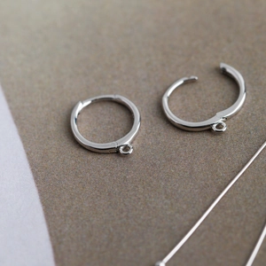 Macro shot of silver round leverback earrings with small loop for DIY jewelry making