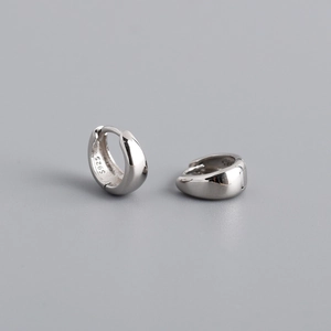 Detailed close-up showing the S925 hallmark on polished silver wide hoop earrings
