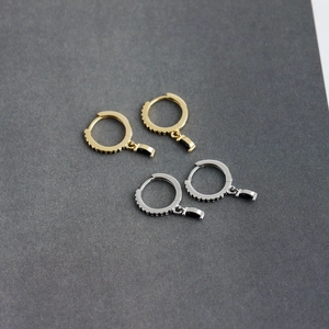 Close-up of S925 silver hoop earrings with black zircon pavé and trapezoid stone drops