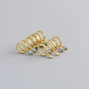 Detailed row of marquise-cut crystal earrings in multi-color stones and gold plating