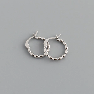 Detailed view of S925 sterling silver hoop earrings with twisted bead texture finish