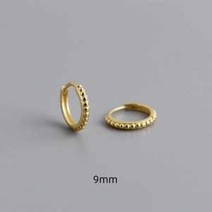 Detail view of 9mm S925 sterling silver gold hoop earrings with beaded dotted texture