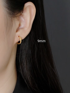 Close-up of 9mm gold-plated S925 sterling silver hoop earrings with bead texture