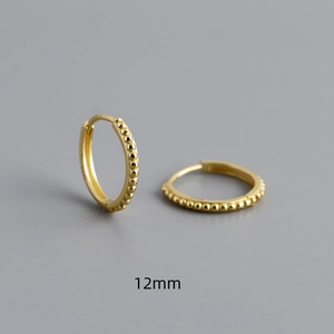 Detail of 12mm S925 sterling silver gold hoop earrings with textured bead pattern