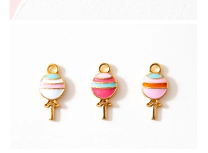 Macro view of colorful striped lollipop charms with gold alloy base for DIY jewelry