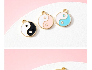 Detailed macro view of colorful Tai Chi Yin Yang enamel charms for DIY jewelry making