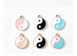 Detailed view of six colorful Yin Yang enamel charms for DIY jewelry crafting and accessories