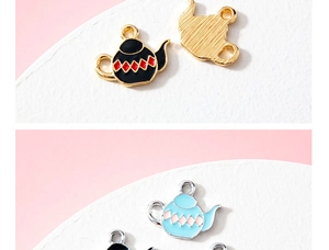 Detail view of teapot charms featuring checkered oil drip patterns and alloy base texture