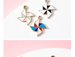 Close-up view of colorful windmill enamel charms for handmade DIY jewelry making