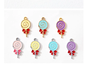 Detailed close-up of lollipop charms with colorful enamel and decorative bows for DIY jewelry