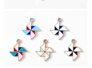 Detail of colorful windmill alloy pendants with enamel drip finish for DIY jewelry