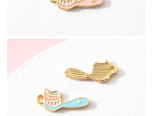 Detail of DIY enamel alloy toothbrush charms for jewelry making in pink and blue