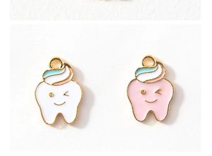 Detail showing cute wink-face tooth pendants with colorful enamel coating on gold alloy