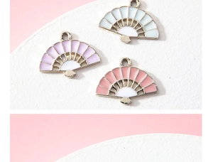 Detail of fan-shaped enamel charms in pastel colors for DIY jewelry and crafts