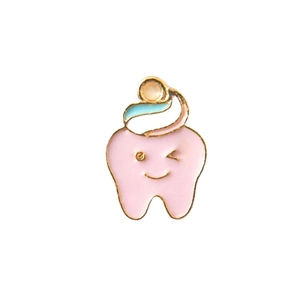 Cute enamel tooth pin with smiling face and pink coating featuring gold metal edges