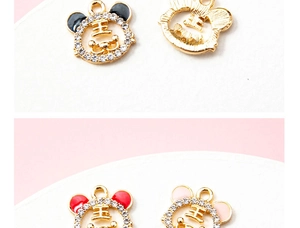 Detail of tiger head alloy pendants with sparkling rhinestones in black, red, and pink