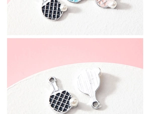 Detail of DIY pearl table tennis paddle charms with colorful grid and metal texture