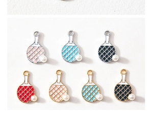 Detail of colorful ping pong paddle pendants with pearl accents and enamel finish