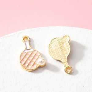 Pink enamel table tennis racket pendant with pearl detail and gold plated alloy finish
