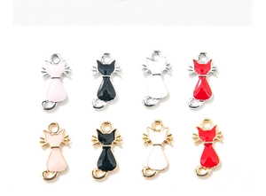 Detailed close-up of colorful enamel cat pendants for DIY jewelry and bracelets