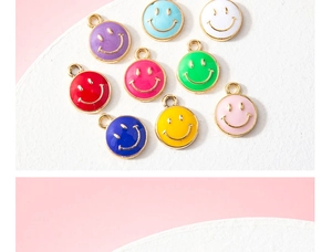 Detailed collection of multi-colored enamel smiley face charms with golden metal bases