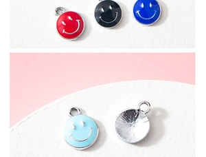 Detailed view of colorful enamel smiley face alloy charms for DIY jewelry making