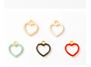 Flat lay of colorful heart-shaped enamel charms with gold-plated alloy base for DIY